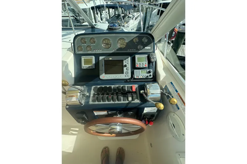 Slide: The Image of 2005 Tiara Yachts 2900 Coronet helm with navigation instruments and steering wheel. - 12