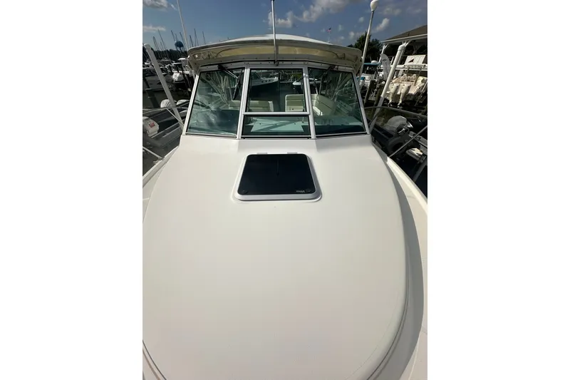Slide: The Image of 2005 Tiara Yachts 2900 Coronet boat deck with windshield, docked at marina. - 6