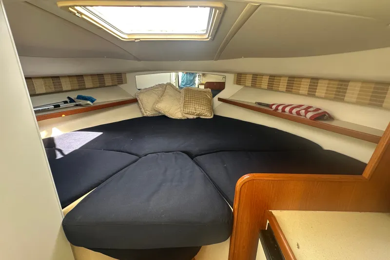 Slide: The Image of 2005 Tiara Yachts 2900 Coronet cabin interior with cushions and natural light. - 14