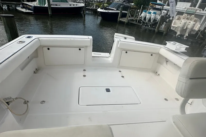 Slide: The Image of 2005 Tiara Yachts 2900 Coronet boat deck, spacious and clean, docked at marina. - 7