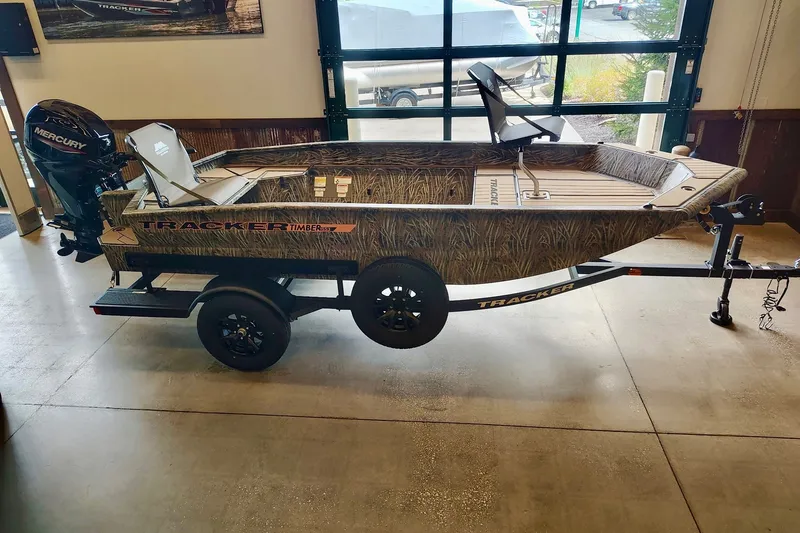 The Image of 2027 Tracker Grizzly 1553 Timber boat with Mercury engine on trailer in showroom. - 0