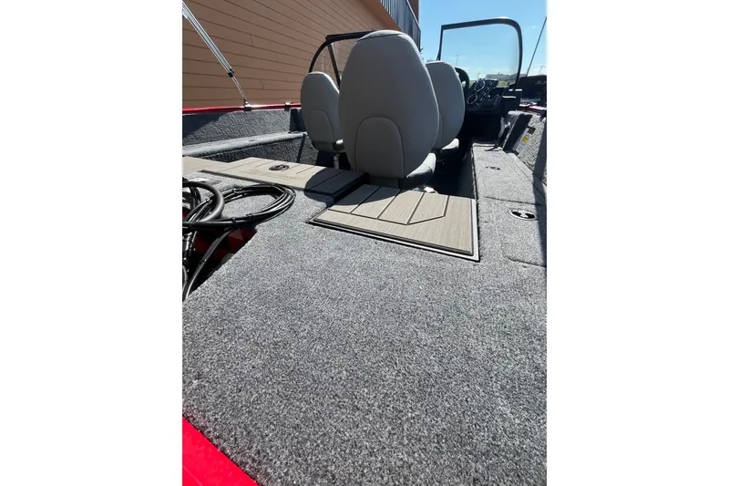 Slide: The Image of 2027 Tracker Pro Guide V-175 Combo boat interior with seating and carpeted flooring. - 49