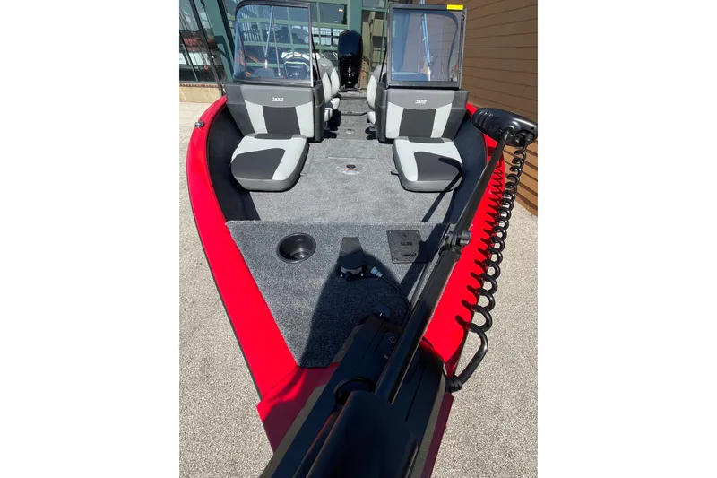 Slide: The Image of 2027 Tracker Pro Guide V-175 Combo boat with red exterior and dual seating. - 58