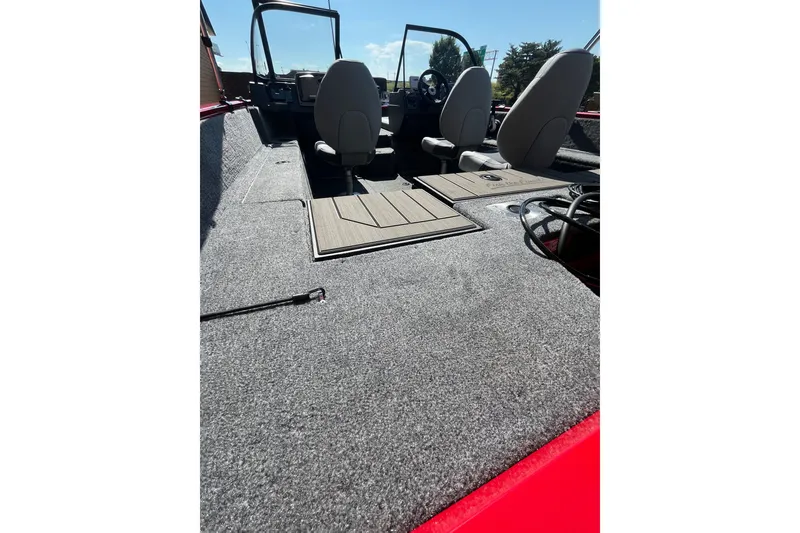 Slide: The Image of 2027 Tracker Pro Guide V-175 Combo boat interior with seating and carpeted flooring. - 60