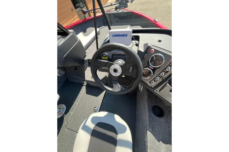 Slide: The Image of 2027 Tracker Pro Guide V-175 Combo boat dashboard with steering wheel and Lowrance display. - 51