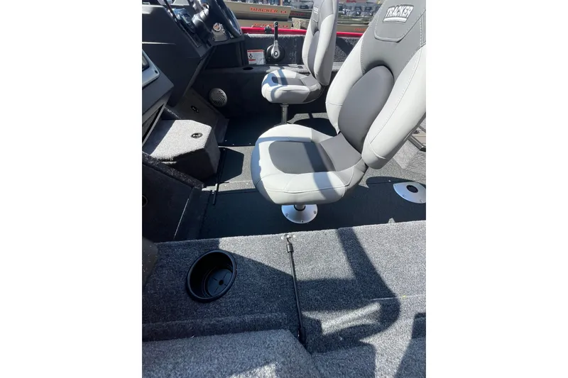 Slide: The Image of 2027 Tracker Pro Guide V-175 Combo boat interior with gray seating and carpeted flooring. - 53