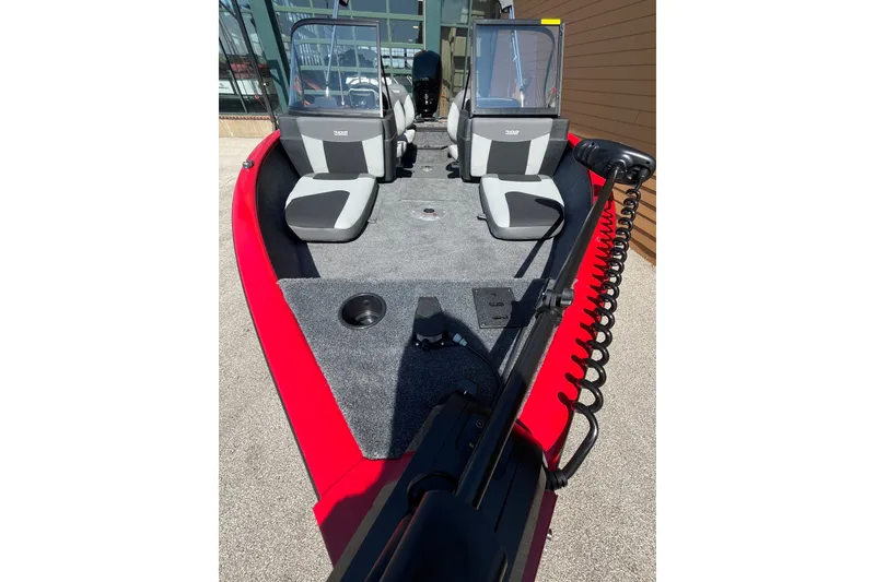 Slide: The Image of 2027 Tracker Pro Guide V-175 Combo boat with red exterior and dual seating. - 59