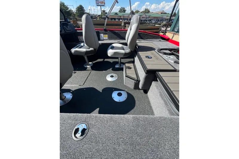 Slide: The Image of 2027 Tracker Pro Guide V-175 Combo boat interior with seating and storage compartments. - 52