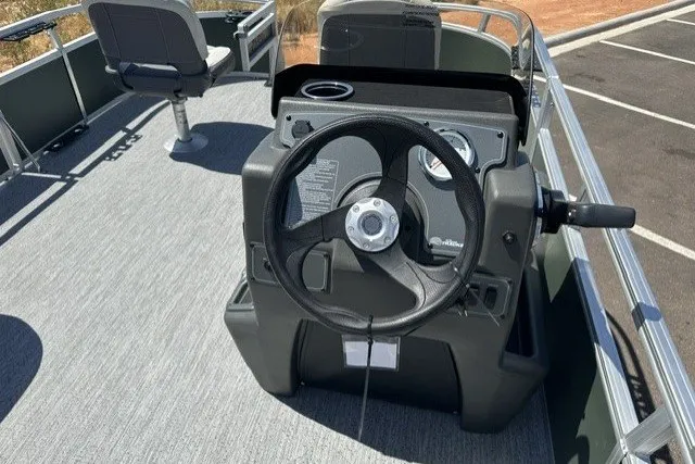 Slide: The Image of 2027 Sun Tracker Bass Buggy 16 XL Select boat interior with steering console and seating. - 13