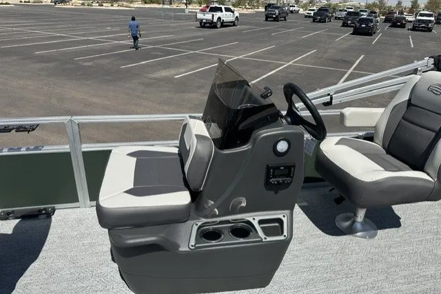 Slide: The Image of 2027 Sun Tracker Bass Buggy 16 XL Select boat interior with steering console and seating. - 14