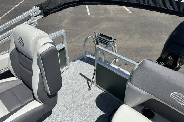Slide: The Image of 2027 Sun Tracker Bass Buggy 16 XL Select pontoon boat interior with seating and railing. - 17