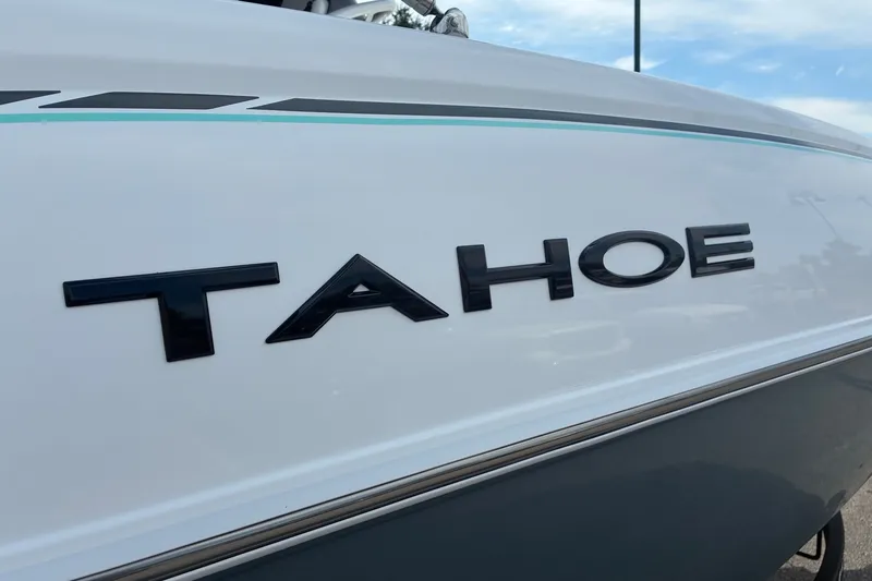 Slide: The Image of 2027 Tahoe 2150 CC boat side view with logo and sleek design. - 3