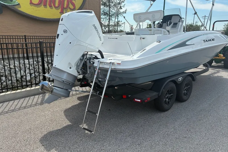 Slide: The Image of 2027 Tahoe 2150 CC boat with Mercury outboard engine on a trailer. - 2