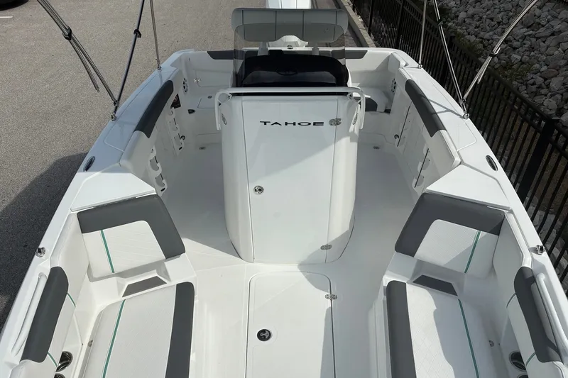 Slide: The Image of 2027 Tahoe 2150 CC boat interior with seating and console, showcasing modern design. - 9