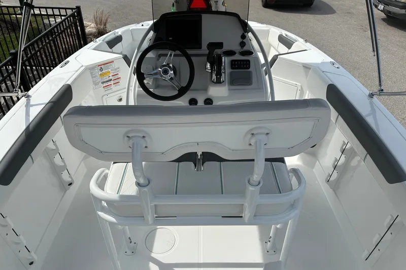 Slide: The Image of 2027 Tahoe 2150 CC boat interior with steering wheel and seating. - 6
