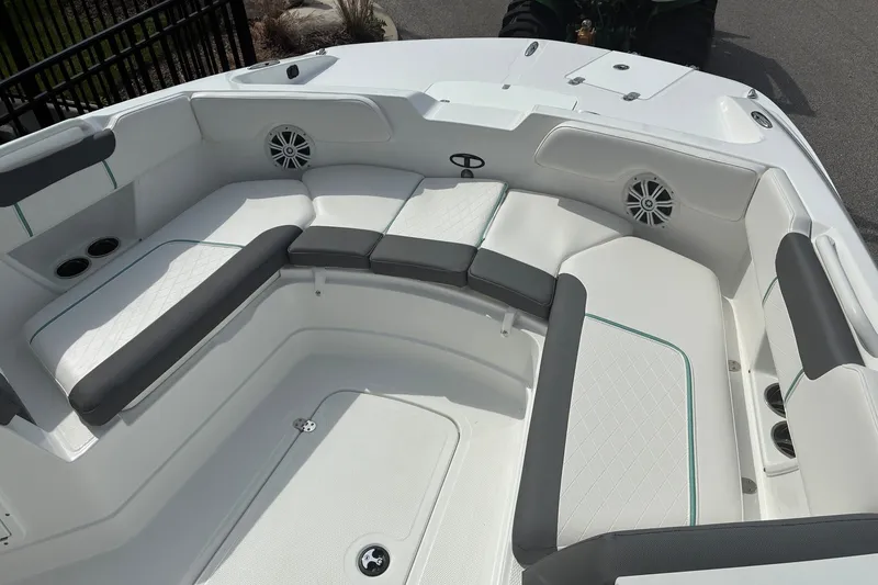 Slide: The Image of Interior of 2027 Tahoe 2150 CC boat with cushioned seating and cup holders. - 8