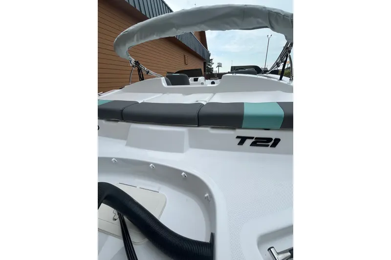 Slide: The Image of 2027 Tahoe T21 boat with sleek design and comfortable seating. - 6
