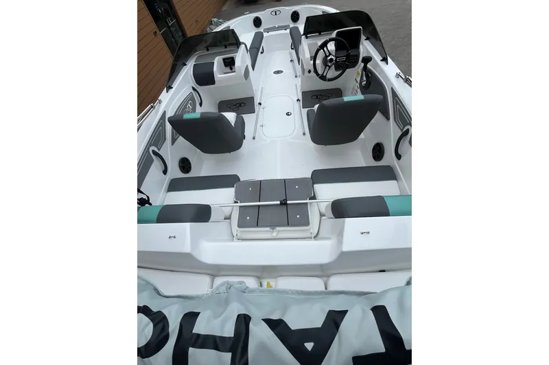 Slide: The Image of 2027 Tahoe T21 boat interior with modern seating and steering console. - 3