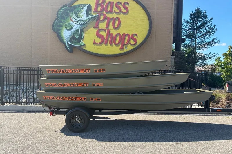 The Image of 2027 Tracker Grizzly 12 Jon boats stacked outside Bass Pro Shops. - 0