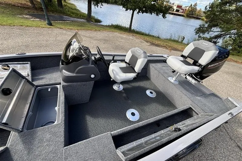Slide: The Image of 2027 Tracker Super Guide V-16 SC fishing boat interior with seating and storage compartments. - 18