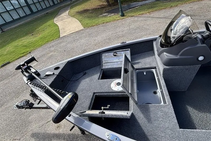 Slide: The Image of 2027 Tracker Super Guide V-16 SC boat interior with storage compartments and control panel. - 19