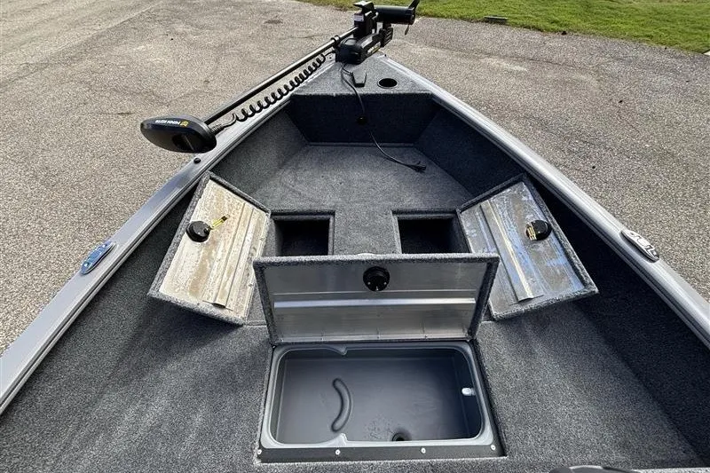 Slide: The Image of 2027 Tracker Super Guide V-16 SC boat interior with open storage compartments. - 16
