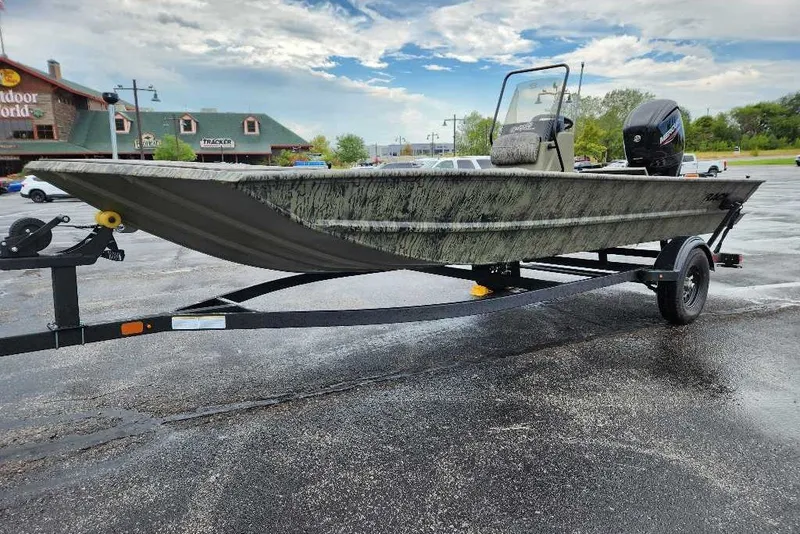 The Image of 2027 Tracker Grizzly 1860 CC boat on trailer in parking lot. - 0
