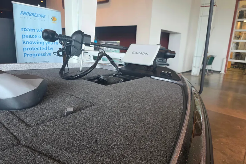 Slide: The Image of 2027 Nitro Z21 XL Pro boat with Garmin navigation system displayed indoors. - 2