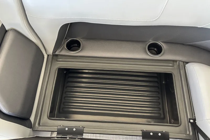 Slide: The Image of Storage compartment with cup holders on 2027 Sun Tracker Party Barge 18 DLX boat. - 32