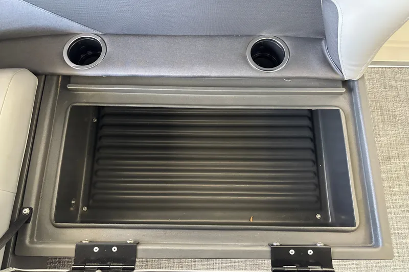 Slide: The Image of Storage compartment with cup holders on 2027 Sun Tracker Party Barge 18 DLX. - 30