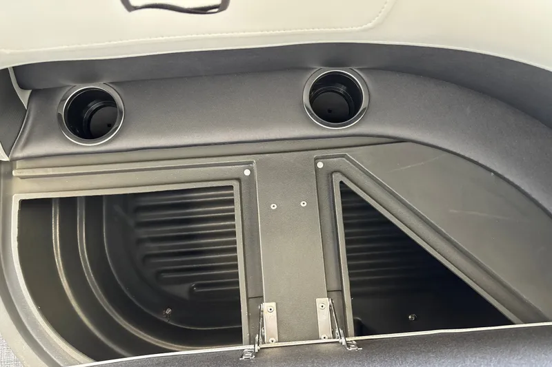Slide: The Image of Interior storage compartment of 2027 Sun Tracker Party Barge 18 DLX with cup holders. - 31