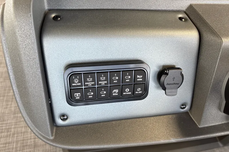 Slide: The Image of Control panel of 2027 Sun Tracker Party Barge 18 DLX with USB port and switches. - 26