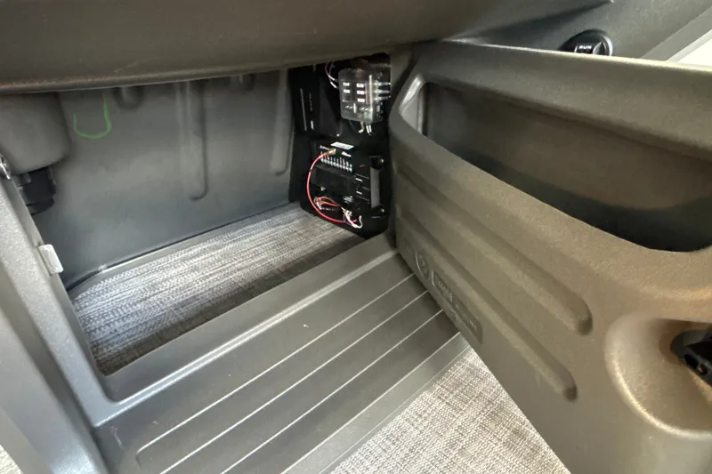 Slide: The Image of Interior view of 2027 Sun Tracker Party Barge 18 DLX, showcasing storage compartment. - 36