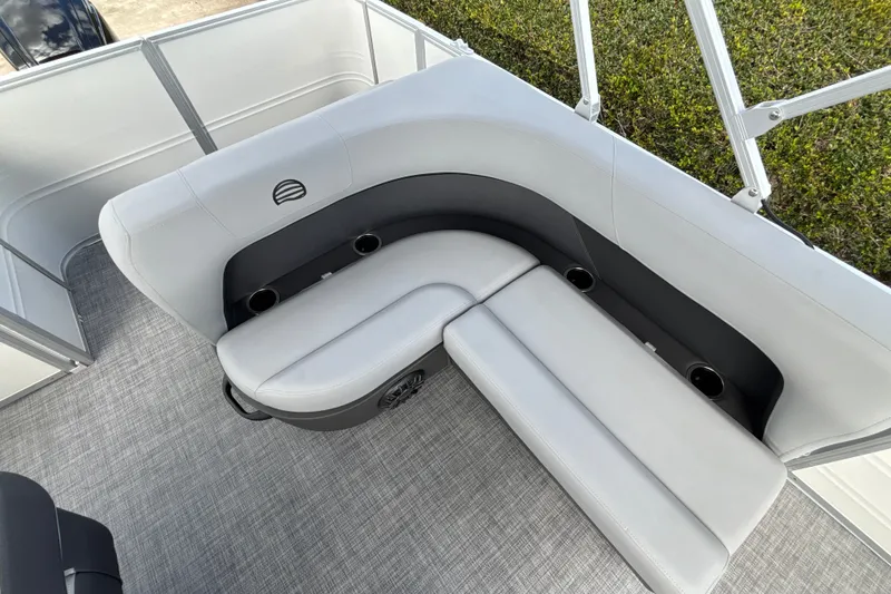 Slide: The Image of 2027 Sun Tracker Party Barge 18 DLX interior seating with cup holders and sleek design. - 16