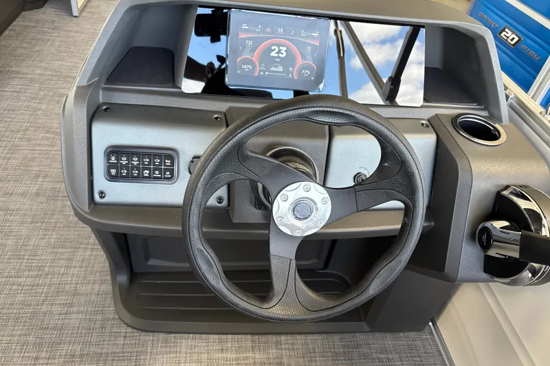 Slide: The Image of Steering console of 2027 Sun Tracker Party Barge 18 DLX with digital display. - 24