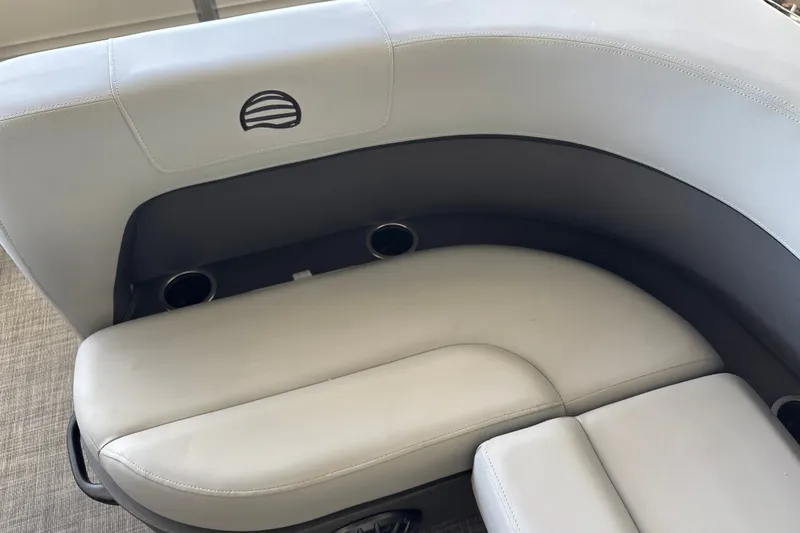 Slide: The Image of Sun Tracker Party Barge 18 DLX 2027 interior seating with cup holders. - 17