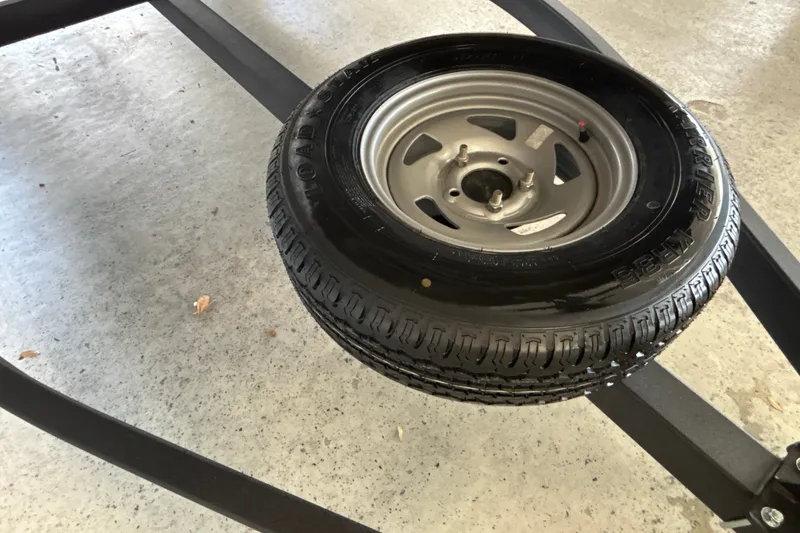 Slide: The Image of Spare tire mounted on a trailer for a 2027 Sun Tracker Party Barge 18 DLX. - 39
