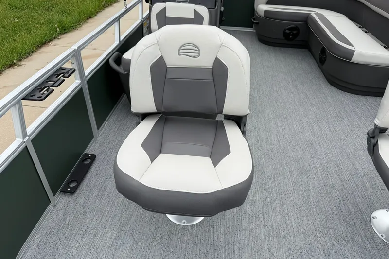Slide: The Image of 2027 Sun Tracker Bass Buggy 16 XL Select boat interior with gray and white seating. - 13