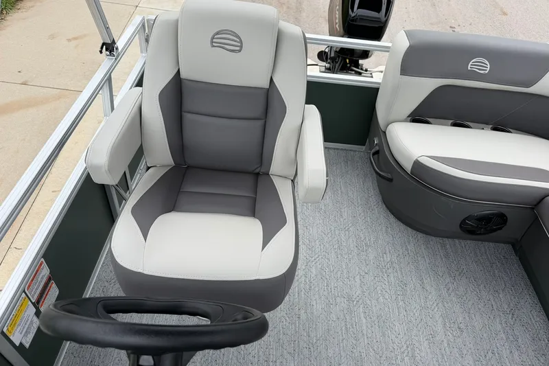 Slide: The Image of 2027 Sun Tracker Bass Buggy 16 XL Select interior with gray and white seating. - 17