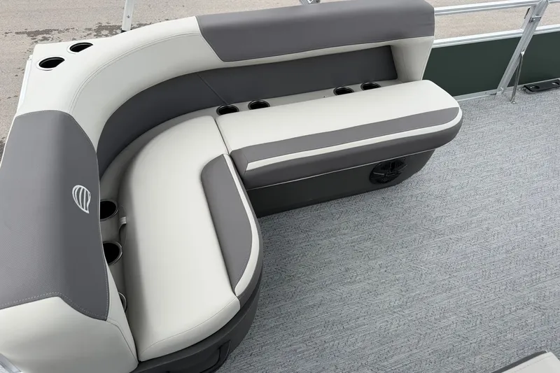Slide: The Image of 2027 Sun Tracker Bass Buggy 16 XL Select pontoon boat seating with cup holders and gray upholstery. - 19