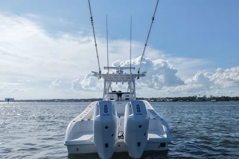 Slide: The Image of 2014 Yellowfin 32 Offshore boat with twin 400 V10 engines on open water. - 24