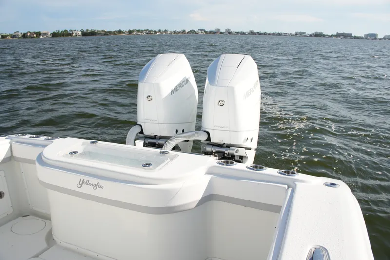 Slide: The Image of 2014 Yellowfin 32 Offshore boat with dual Mercury engines on open water. - 29