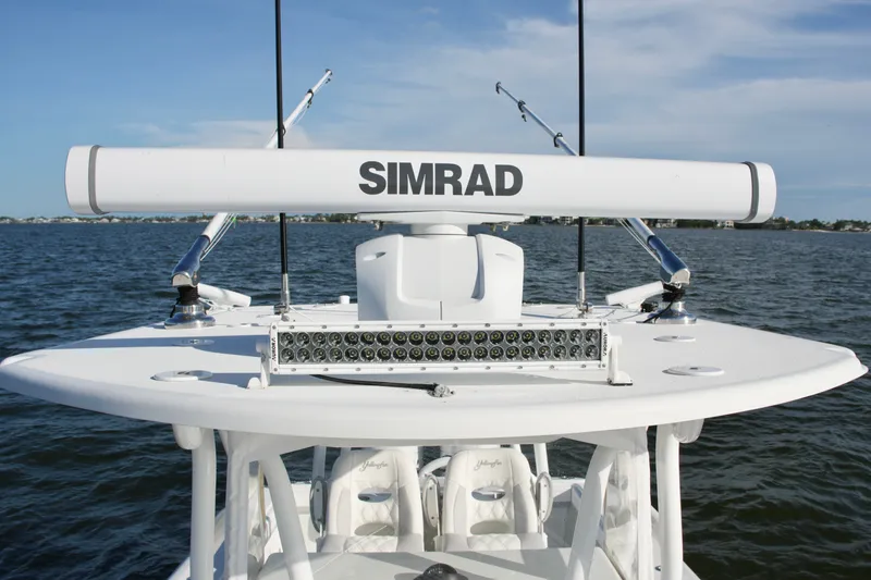Slide: The Image of 2014 Yellowfin 32 Offshore boat with Simrad radar on open water. - 56