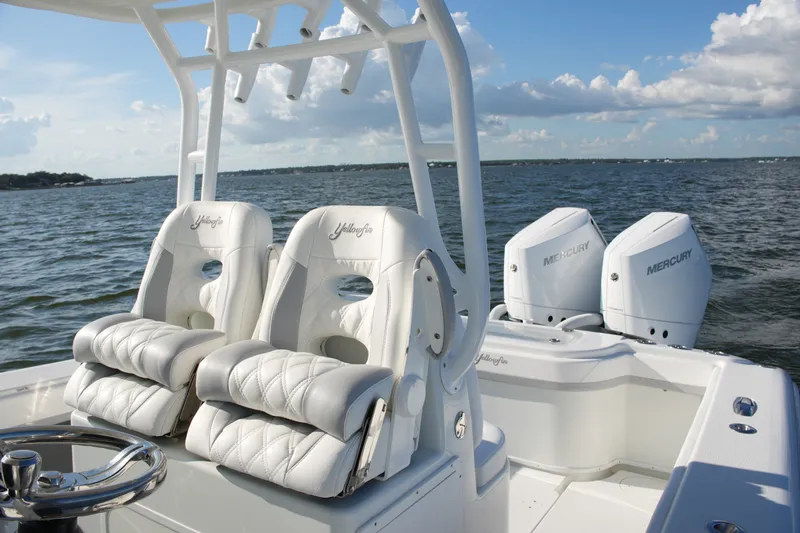 Slide: The Image of 2014 Yellowfin 32 Offshore boat with dual Mercury engines on open water. - 39