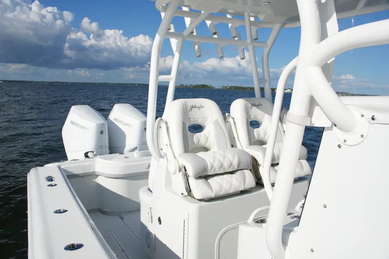 Slide: The Image of 2014 Yellowfin 32 Offshore boat with Mercury engines on open water. - 42