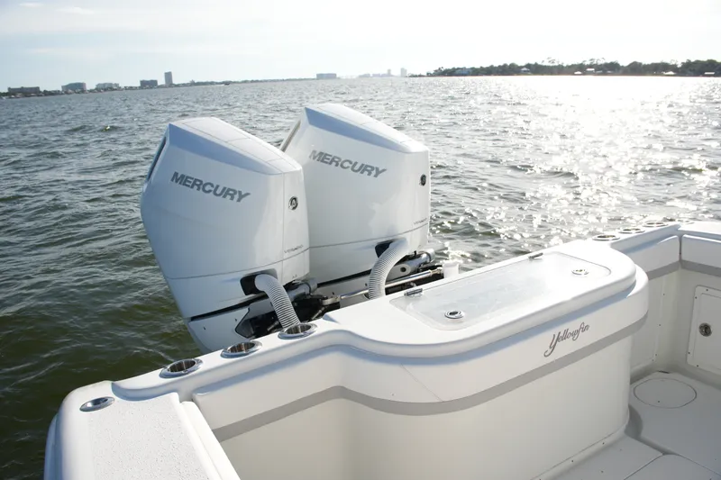 Slide: The Image of 2014 Yellowfin 32 Offshore boat with twin Mercury engines on open water. - 26