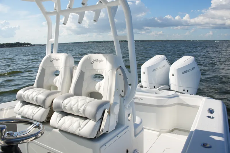Slide: The Image of 2014 Yellowfin 32 Offshore boat with dual Mercury engines on open water. - 40