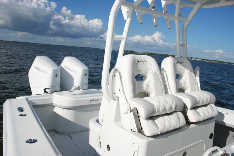 Slide: The Image of 2014 Yellowfin 32 Offshore boat with twin Mercury engines on open water. - 43