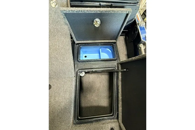 Slide: The Image of 2024 Nitro ZV20 boat storage compartments with open lids, showcasing interior design. - 19