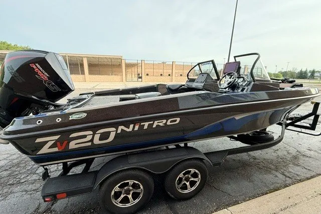 Slide: The Image of 2024 Nitro ZV20 boat on trailer, sleek design, parked outdoors. - 11
